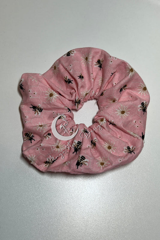 pink fabric with white daisies and bee's scrunchie