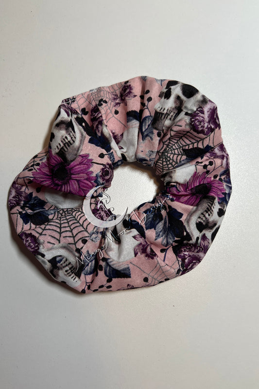Pink fabric with purple roses white skulls and spiderwebs scrunchie