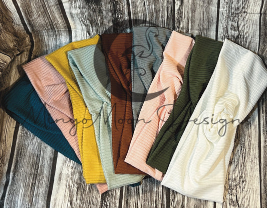 Twisted Headbands in a ribbed knitted fabric colors are warm neutrals. Blue, Rose pink, Mustard yellow, Pistachio, Rust, Gray, Light pink, Olive, White- for adults/teens.
