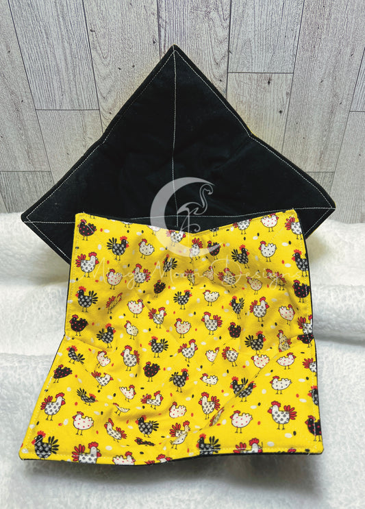 White and black chickens on Yellow polka dot fabric with a reversible solid black side.