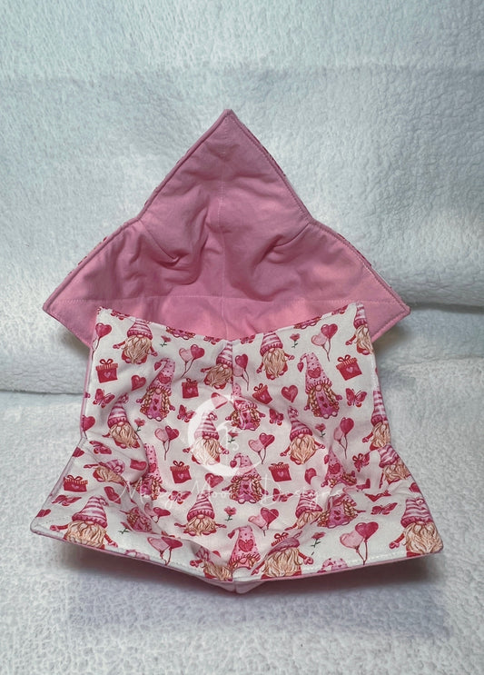 White fabric with love gnomes on one side and pink matching fabric for the other side.